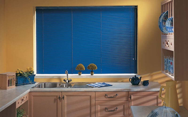 Blue aluminium blinds in a Canberra kitchen supplied by The Blind Shop