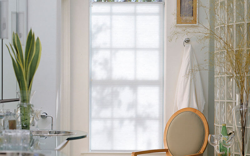 an image of honecomb blinds in a modern bathroom