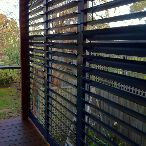 Outdoor aluminium shutter blinds in navy from The Blind Shop in Canberra