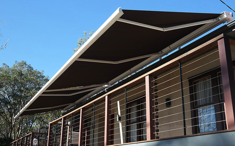 A canberra balcony with a retractable awning from the blind shop