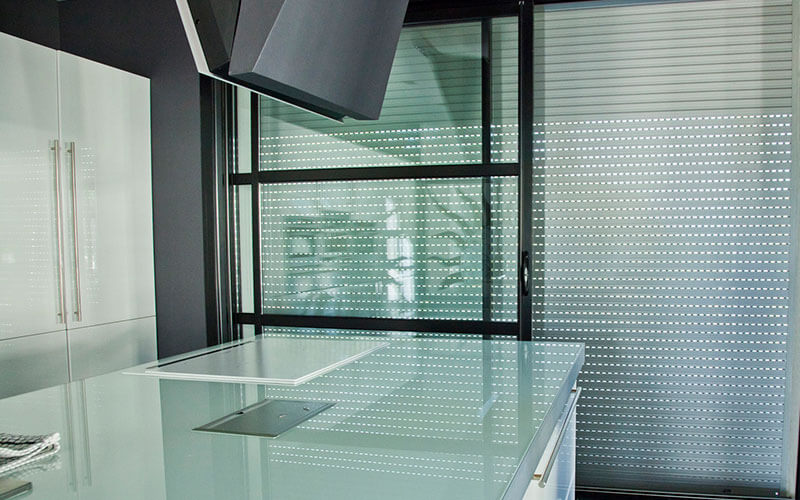 Roller shutter blinds in a modern Canberra Kitchen. The Blind Shop can install yours today!