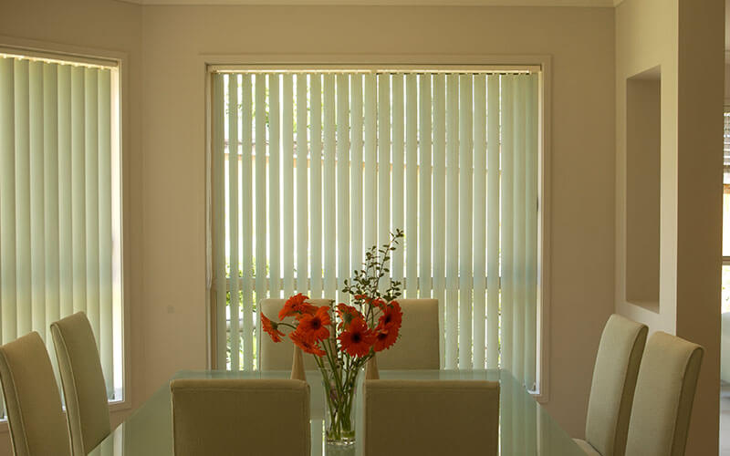 a canberra dining room with vertical blinds from The Blind Shop